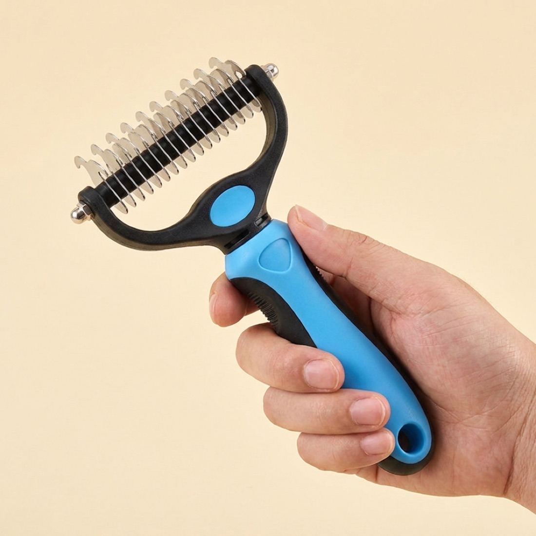 The comb held in hand for scale