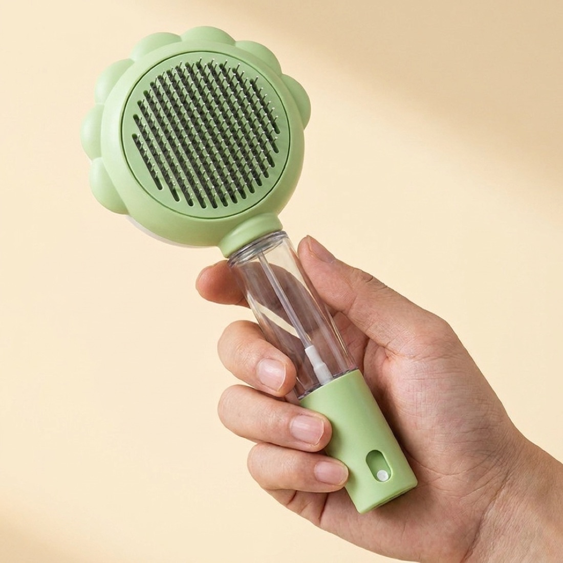 The comb held in hand for scale