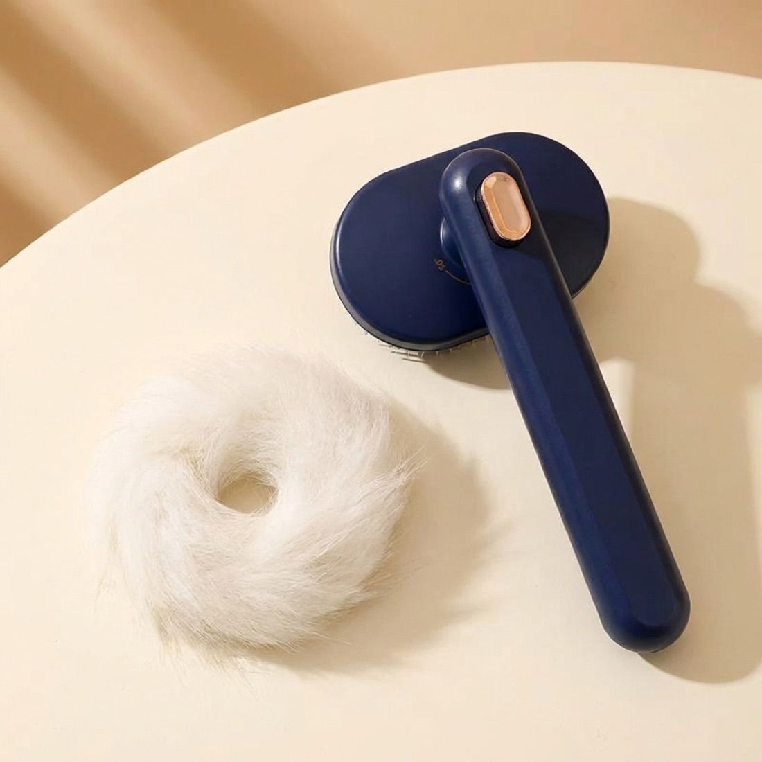 Released fur beside the brush, showing the one-key release