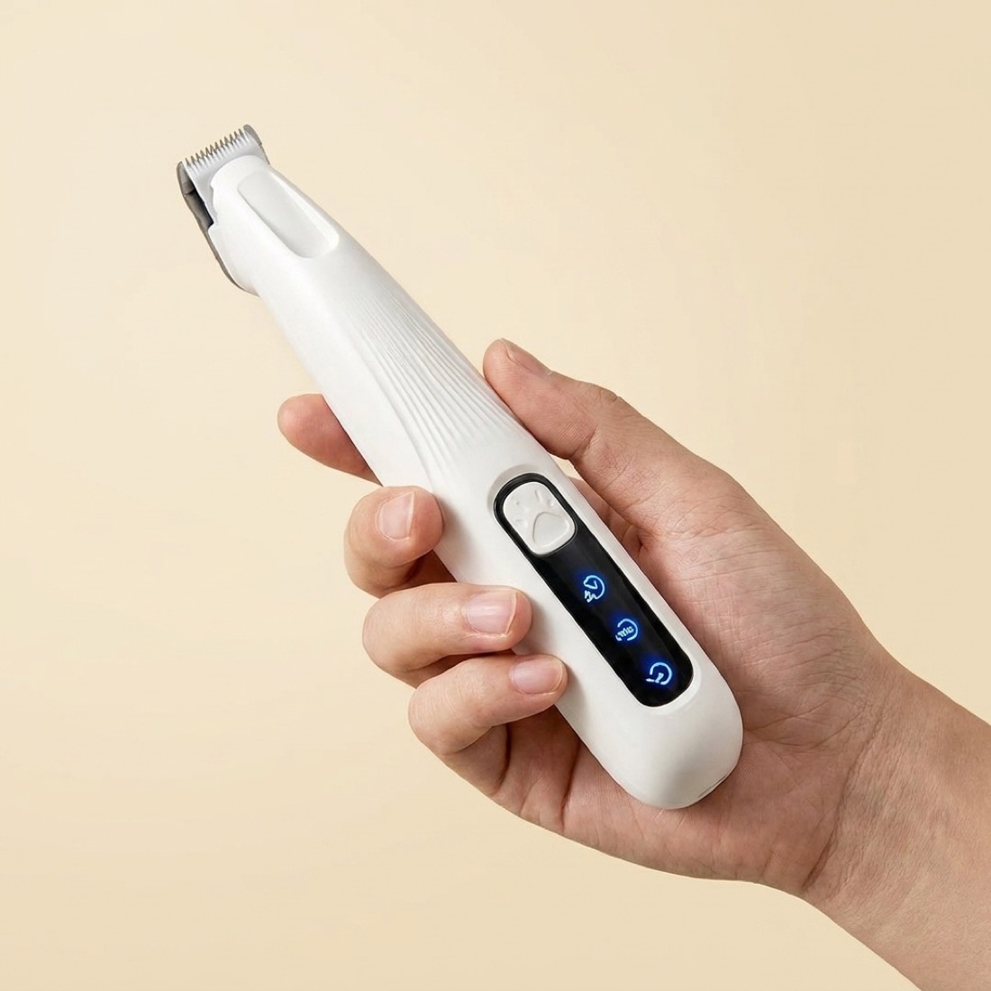 The trimmer held in hand for scale